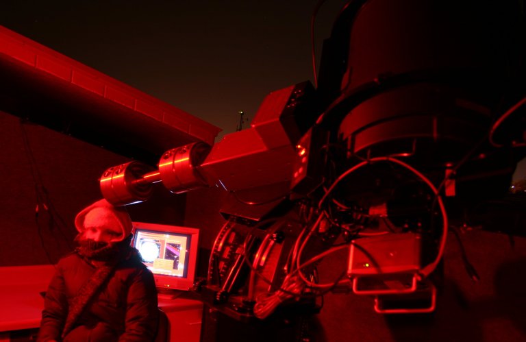 Student Erin Benoy with the Platte Telescope